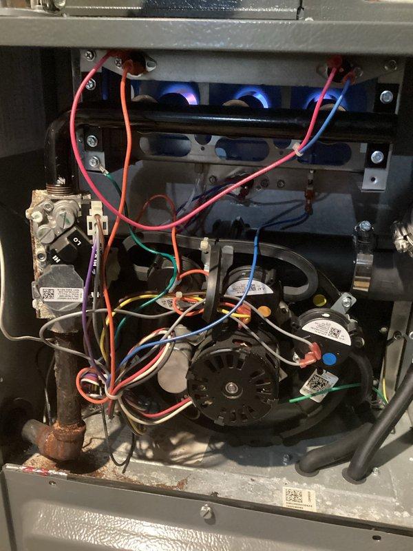 Responded to service call for furnace with intermittent ignition failure. Diagnosed issue with gas valve not properly carrying flame across all burners, causing system shutdown. Performed temporary adjustment to gas pressure to improve operation, though valve still not meeting specifications. Recommended replacement of gas valve to resolve recurring ignition problems. Noted moisture/corrosion near fresh air intake likely contributing to component malfunction.