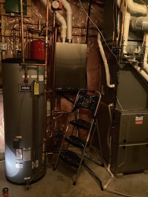 Responded to recall service for insufficient hot water temperature after recent check valve installation on recirculation line. Diagnosed faulty mixing valve in IBC boiler system with tanked water heater setup. Provided customer with replacement options for the mixing valve to resolve the lukewarm water issue.