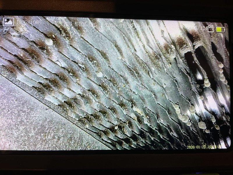 Diagnosed failed inducer draft motor causing no heat condition. Inspection revealed secondary heat exchanger with areas approaching rust perforation and potential plugging, which likely contributed to inducer failure. Due to safety concerns with the aging heat exchanger, recommended replacement of the entire furnace and scheduled same-day estimate.