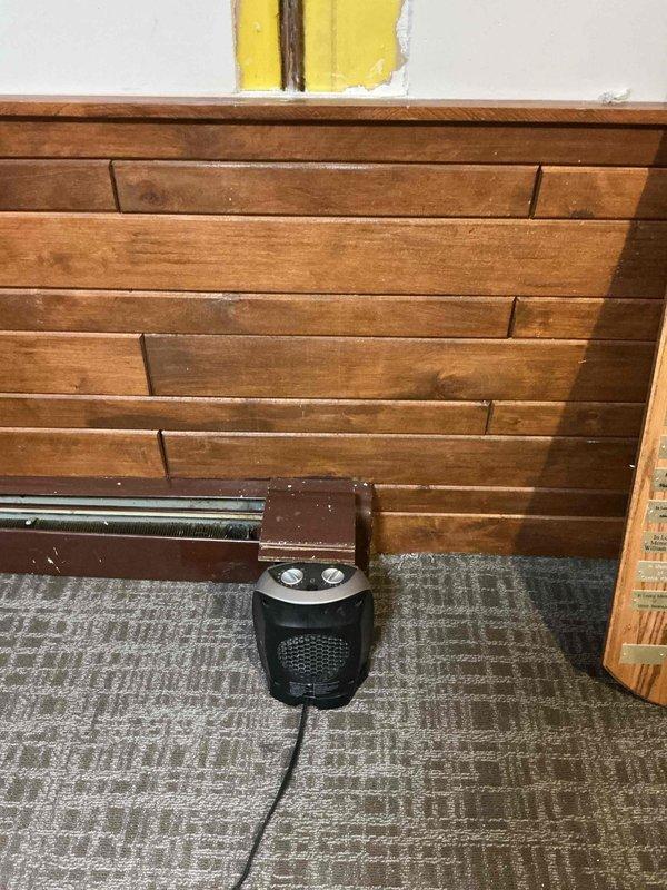 Responded to service call for a tanked water heater that required relighting after HVAC work. Technician successfully relit pilot light and confirmed proper operation of the water heater that had been inadvertently extinguished during previous furnace installation.