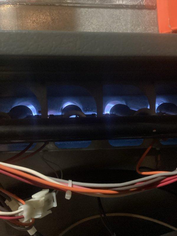 Responded to no heat complaint on a system experiencing intermittent operation. Diagnosed failed ignition sequence with flames extinguishing shortly after lighting. Found dirty filter restricting airflow and debris accumulation on flame sensor. Cleaned flame sensor, replaced filter, and verified proper system operation. Noted secondary heat exchanger and evaporator coil require cleaning due to significant buildup, and inducer motor drawing high amperage with excessive noise indicating potential failure.