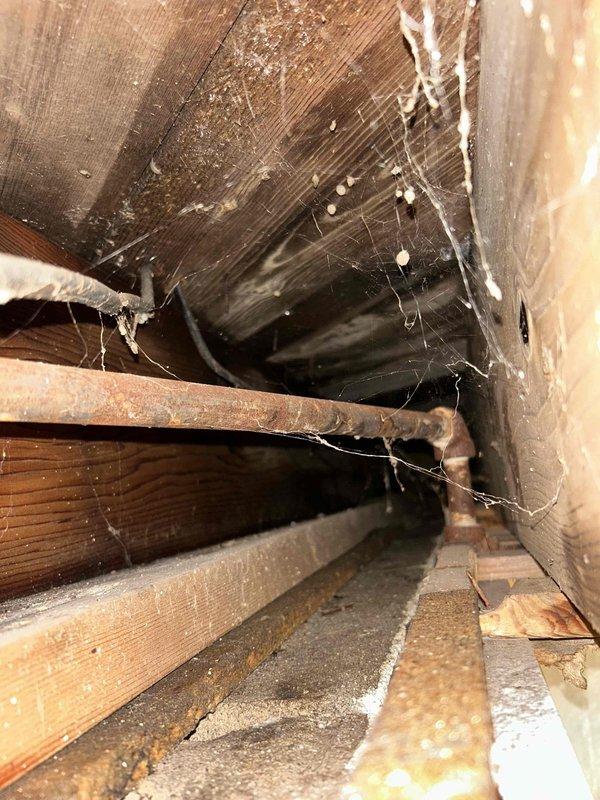 Responded to urgent service call for water leakage from boiler affecting living room and exterior of unoccupied property. Diagnosed issue as non-functioning main level pump causing water intrusion. Removed problematic radiator, installed shut-off valves, and drained boiler system to complete necessary repairs. Coordinated with restoration professionals on-site who were managing water damage cleanup.