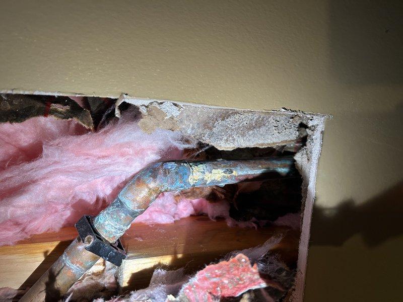 Responded to a basement water leak originating from a deteriorated hose spigot shut-off valve that had been inactive for several years. Inspection revealed significant corrosion on copper piping and a failing solder joint at the outdoor spigot connection, causing water to seep through the basement floor. Completed repairs by replacing the defective valve and resoldering the compromised pipe joint to restore proper function and eliminate the leak.