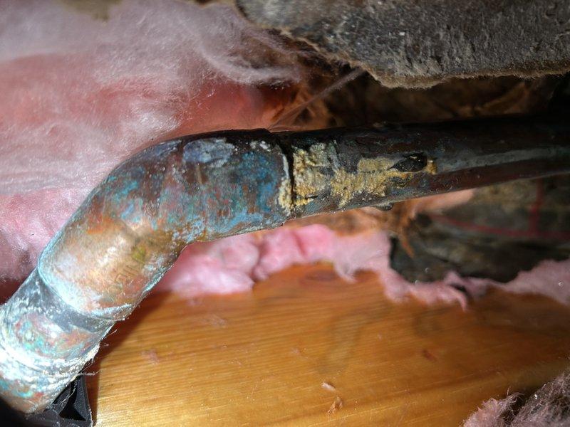 Responded to a basement water leak originating from a deteriorated hose spigot shut-off valve that had been inactive for several years. Inspection revealed significant corrosion on copper piping and a failing solder joint at the outdoor spigot connection, causing water to seep through the basement floor. Completed repairs by replacing the defective valve and resoldering the compromised pipe joint to restore proper function and eliminate the leak.