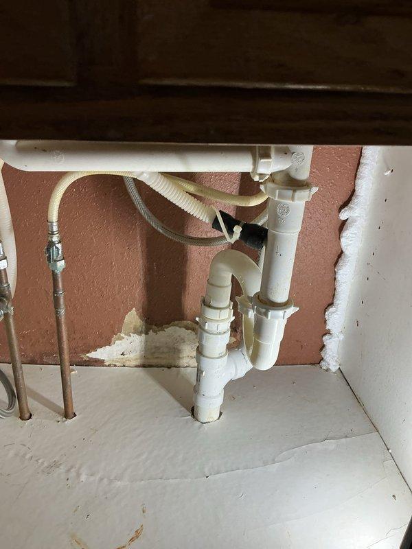 Successfully cleared clogged kitchen sink drain using auger technique. Identified underlying issue of improper pitch in basement piping, with excessive pitch near the stack causing drainage problems. Advised customer that a re-pipe of the kitchen sink line would be recommended as a permanent solution.