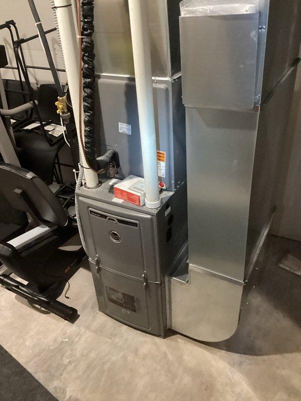 Responded to no heat complaint on 5-year-old furnace with intermittent shutdown issues. Diagnostic testing revealed flame loss codes in system memory. Performed maintenance service including flame sensor cleaning and gas pressure verification (found slightly low at 9.8" inlet, 4.8" manifold). System operated continuously during 30-minute observation period after service. Recommended replacement of both house and tank regulators through propane company if issues persist.