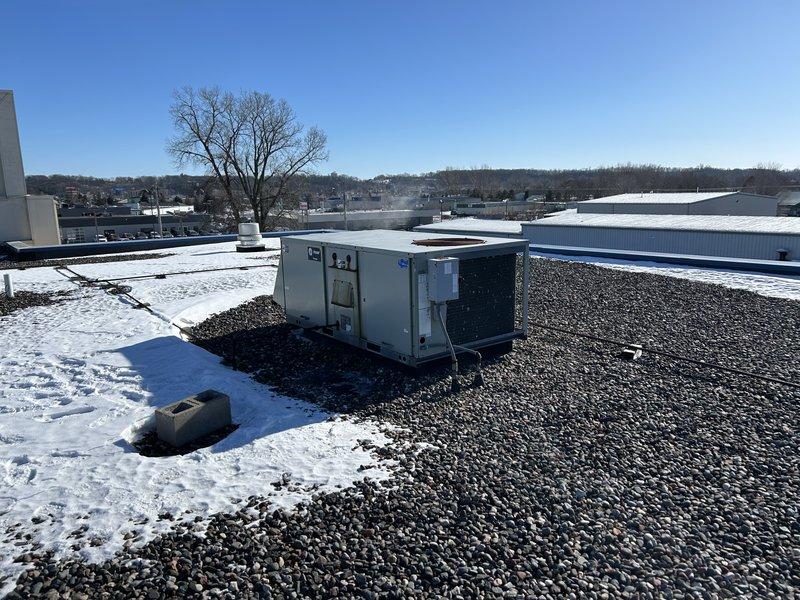 Responded to service call for five non-operational rooftop units. Diagnosed multiple issues including aged equipment requiring replacement on three units, a faulty VFD drive on a newly installed unit, and restored operation to one unit by replacing a defective Trane zone sensor. Identified shorted thermostat wire on Lennox unit caused by improper curb adapter installation and communicated findings to facility manager.