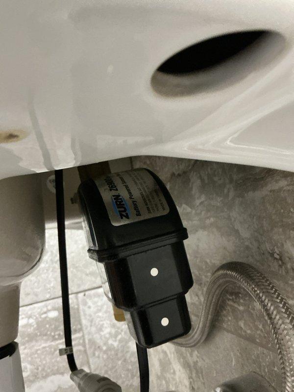 Responded to service call for non-functioning sensor faucet (Zurn brand). Diagnosed issue with water sensing capability despite battery replacement. Performed comprehensive maintenance including disassembly of faucet, cleaning of filter, verification of wire connections, and inspection of flow past mixing valve. After reassembly, faucet operated correctly with proper sensor function restored.