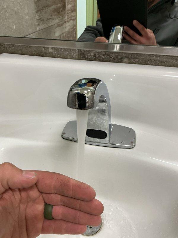 Responded to service call for non-functioning sensor faucet (Zurn brand). Diagnosed issue with water sensing capability despite battery replacement. Performed comprehensive maintenance including disassembly of faucet, cleaning of filter, verification of wire connections, and inspection of flow past mixing valve. After reassembly, faucet operated correctly with proper sensor function restored.