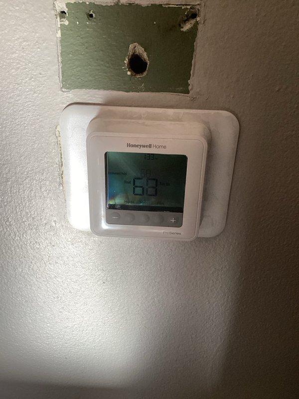 Responded to no heat complaint where customer was experiencing difficulty with programmable thermostat. Upon inspection, found thermostat was following a 62-degree schedule causing reduced airflow. Disabled programming to maintain manual setpoint, demonstrated proper thermostat operation including mode changes, and verified furnace functionality. Customer advised on thermostat options compatible with their two-stage furnace that would provide a larger display and simpler interface.