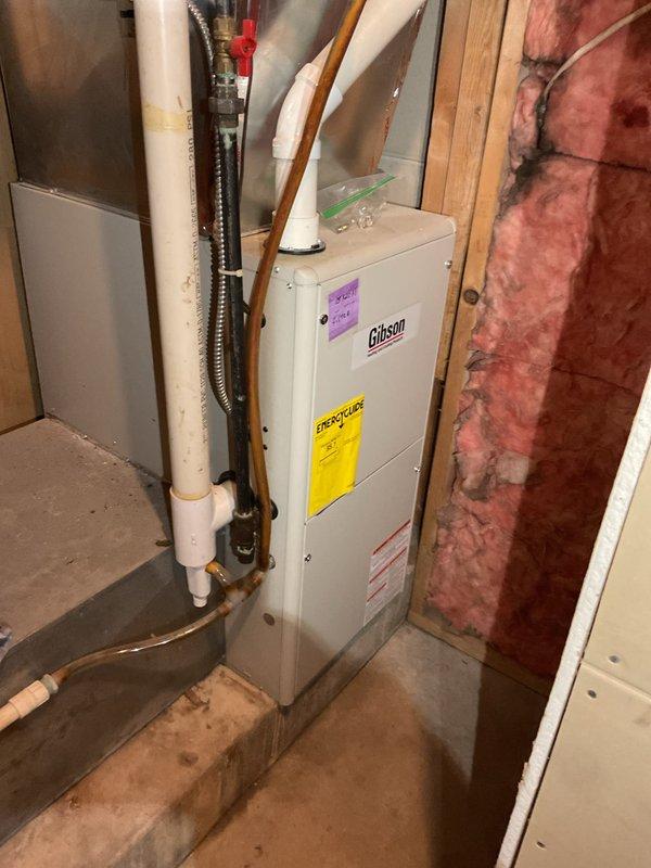 Responded to customer complaint of loud noises during furnace shutdown. Diagnosed partially blocked 15-inch filter causing bellows effect in return ductwork. Demonstrated noise source to homeowner and recommended adding insulation to dampen vibrations and more frequent filter changes. Inspected 10-year-old Gibson furnace system; observed normal blue flame pattern and proper electrical connections. Discussed system age and potential future replacement options with homeowner.