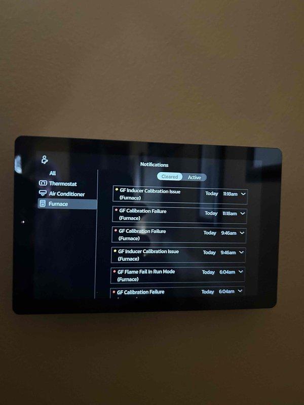 Responded to no heat complaint with furnace showing multiple GF Calibration Failure codes on thermostat. Diagnosed issue as frozen exhaust vent on roof causing intermittent operation. Accessed roof, cleared ice blockage from exhaust vent which restored proper system function and heat production.