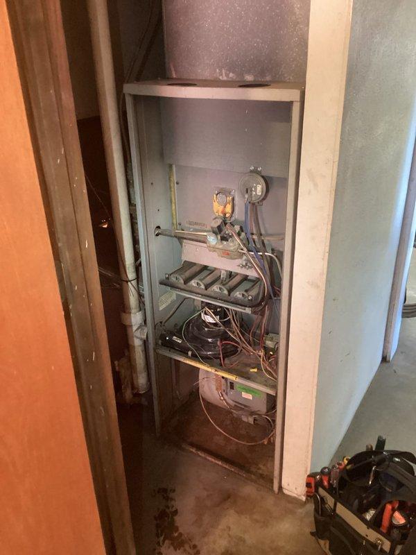 Responded to no heat call for aging furnace servicing office area. Diagnosed seized inducer motor causing system failure. Temporarily freed motor which allowed furnace to operate briefly, but motor seized again upon restart attempt. Inspection of heat exchanger showed no visible issues. Due to equipment age, recommended replacement of entire furnace system as repair parts likely unavailable.