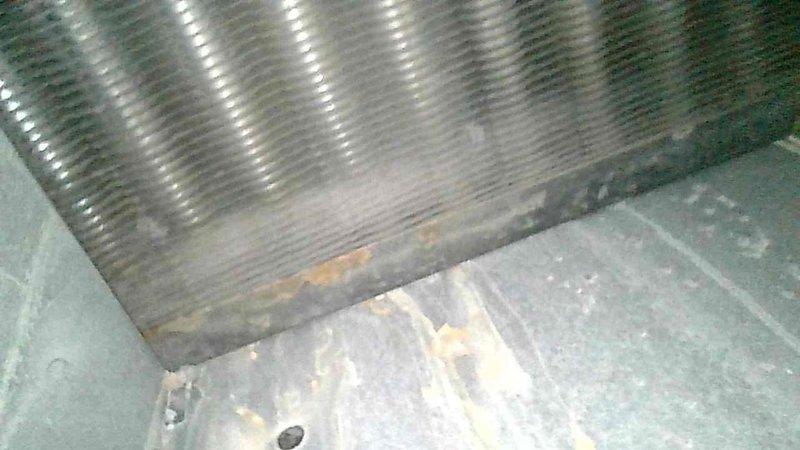 Responded to no-heat call for aging Trane furnace. Diagnostic inspection revealed failed blower motor with worn bearings and approximately 1" crack in primary heat exchanger, with secondary heat exchanger showing signs of leakage. Advised customer against further investment in current system and scheduled follow-up consultation with service advisor.