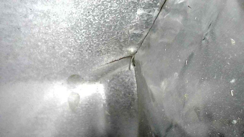 Responded to no-heat call for aging Trane furnace. Diagnostic inspection revealed failed blower motor with worn bearings and approximately 1" crack in primary heat exchanger, with secondary heat exchanger showing signs of leakage. Advised customer against further investment in current system and scheduled follow-up consultation with service advisor.