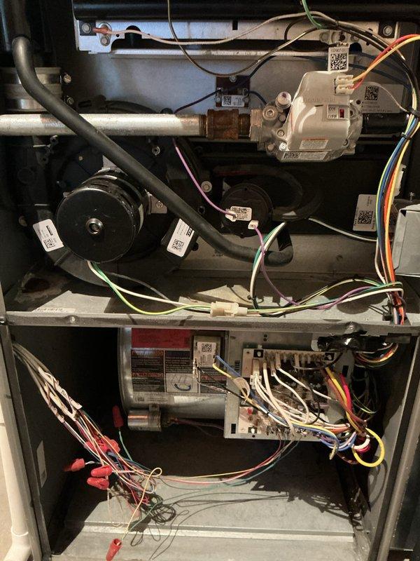 Responded to no heat call for 10+ year old furnace that had previously been serviced for water blockage. Discovered collector box plugged with condensation, inducer draft motor filled with condensation, and secondary heat exchanger plugged with dirt and showing signs of rust-through damage. Performed temporary repair by clearing condensation from lines, trap, and inducer motor, restoring heat. Noted multiple critical issues including failing inducer draft motor, oil-leaking blower motor, and compromised secondary heat exchanger. Recommended full furnace replacement as the appropriate long-term solution.