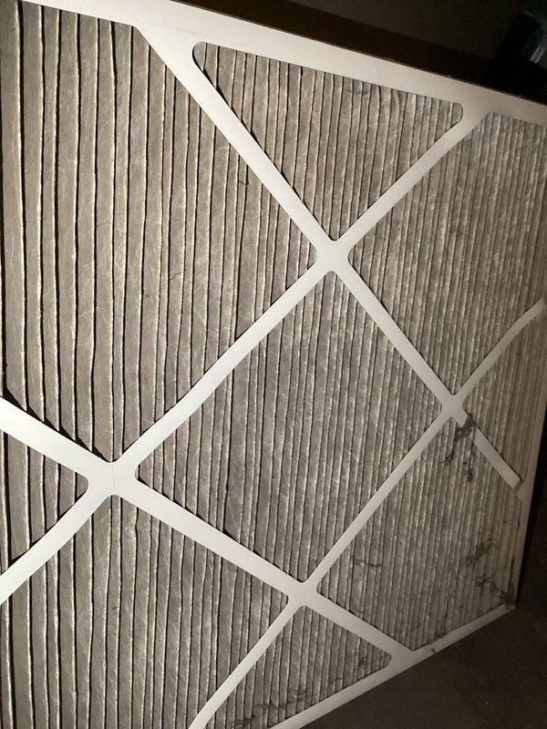 Responded to service call for furnace with "urgent service needed" notification on thermostat. Diagnosed two error codes: restricted airflow and low-voltage wiring issue. Resolved by replacing completely plugged air filter and securing loose connection at heat pump outdoor unit. System now operating normally.