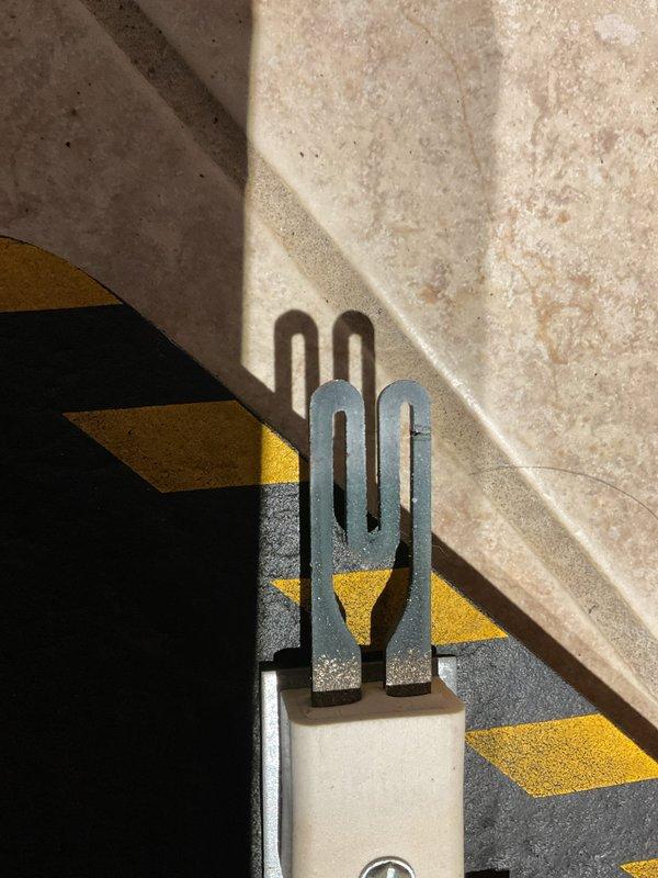 Diagnosed no-heat condition on 10+ year old natural gas furnace with 4 blinking diagnostic lights indicating ignition failure. Cleaned flame sensor and vacuumed combustion chamber, but determined hot surface igniter (HSI) had failed. Replacement part ordered as existing igniter could not be properly fitted despite attempt.