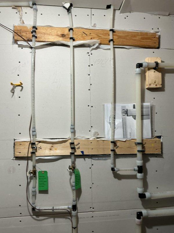 Completed annual plumbing inspection of the property. Examined bathroom fixtures including sink, faucet, and drainage components. Also inspected PVC piping system mounted on support boards in utility area. All plumbing systems appear to be in good working condition with no issues identified.