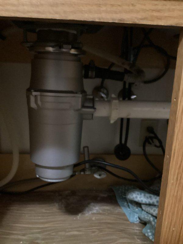 Replaced non-functioning InSinkErator garbage disposal unit due to age-related power reduction and complete failure. Removed old disposal system from kitchen sink, installed new disposal unit, and verified proper operation. Customer was consulted prior to replacement as requested.