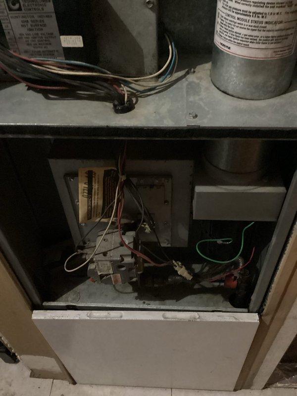 Performed diagnostic service on 20-year-old mobile home furnace (2006 model) that was not producing heat. Inspection revealed non-operational gas valve and igniter as primary failure points. System evaluation showed blower motor running but heavily contaminated and drawing excessive amperage. Heat exchanger inspection identified weak areas but no visible cracks. After reviewing repair options with customer, they elected to pursue a complete system replacement rather than component repairs.