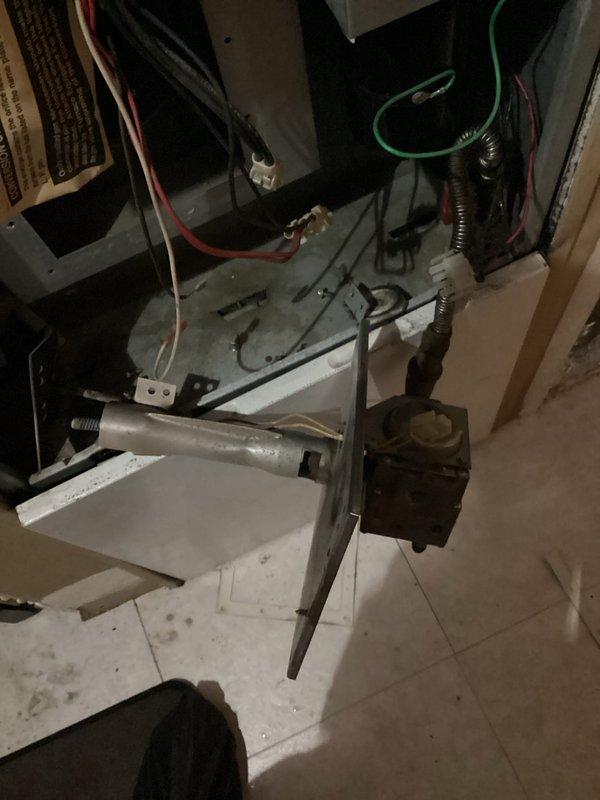 Performed diagnostic service on 20-year-old mobile home furnace (2006 model) that was not producing heat. Inspection revealed non-operational gas valve and igniter as primary failure points. System evaluation showed blower motor running but heavily contaminated and drawing excessive amperage. Heat exchanger inspection identified weak areas but no visible cracks. After reviewing repair options with customer, they elected to pursue a complete system replacement rather than component repairs.