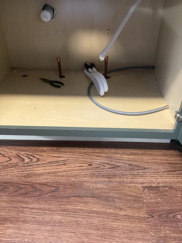 Completed installation of kitchen faucet with upgraded water supply lines and new shut-off valves. Connected plumbing to sink and installed shut-off valves for icemaker and dishwasher. Dishwasher installation was not performed as part of this service.