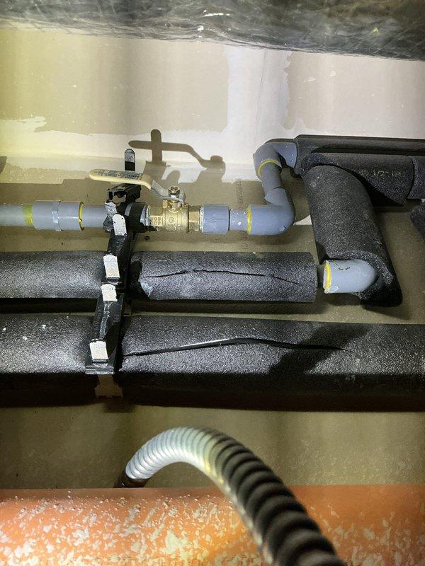 Diagnosed water heater failure caused by loose wire that resulted in electrical short, damaging the blower and main control board. Replaced defective components under warranty and verified proper operation of water heater. Inspected surrounding pipe insulation and connections to ensure no additional damage to the system.