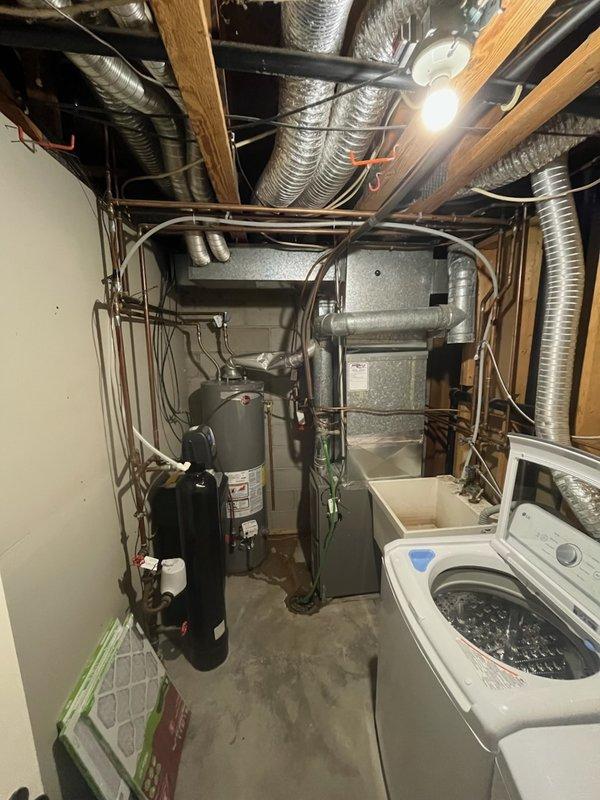 Responded to service call for water heater with pilot light failure and tank leak. Upon inspection, determined tank was compromised and unrepairable. Removed existing unit and installed new tanked water heater with proper gas line and copper pipe connections in basement utility area.