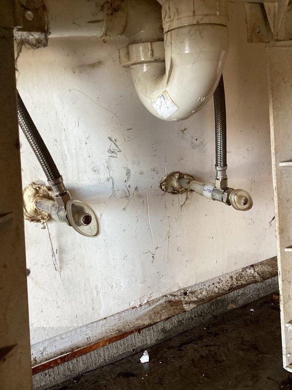 Responded to service call for water leakage from supply lines in garage laundry tub. Replaced laundry supply lines to address the immediate leak issue. Recommended installation of interior shut-off valves with drain-down capability for freeze protection, but customer opted to defer this preventative measure.