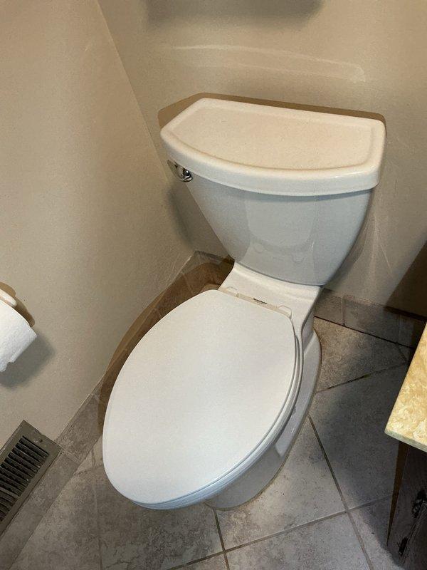 Responded to a service call for toilet leaking through to first floor when flushed. Diagnosed issue as deteriorated wax ring seal at toilet base. Removed toilet, replaced with new wax ring, and properly reset fixture. Verified proper connection of water supply line and tested flush cycle to confirm leak resolution.