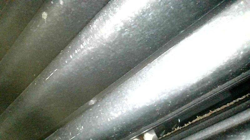 Diagnosed 1999 Carrier Weather Maker furnace with failed heat exchanger. Visual inspection revealed leakage points and combustion testing confirmed significant blockage. Identified customer had been manually resetting rollout switch to maintain operation. Observed blackening of exhaust tubing and improper combustion odors in living space. Recommended complete replacement of heat exchanger or furnace unit due to safety concerns.