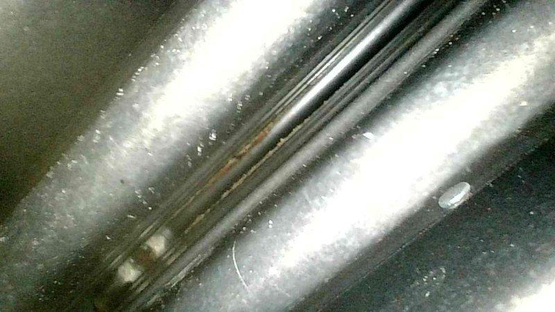 Diagnosed 1999 Carrier Weather Maker furnace with failed heat exchanger. Visual inspection revealed leakage points and combustion testing confirmed significant blockage. Identified customer had been manually resetting rollout switch to maintain operation. Observed blackening of exhaust tubing and improper combustion odors in living space. Recommended complete replacement of heat exchanger or furnace unit due to safety concerns.