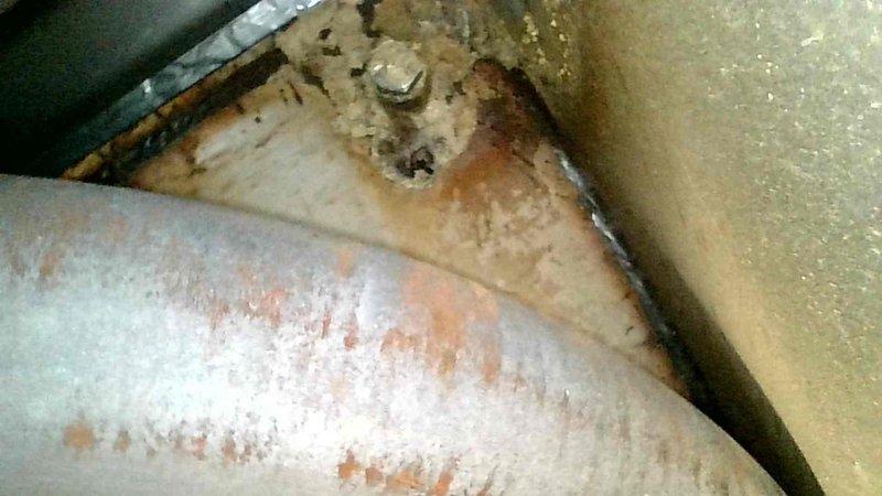 Responded to no-heat call for Lennox Pulse furnace. Upon arrival, determined unit was in safety lockout. Reset system and performed heat exchanger inspection, which revealed a significant hole in the primary heat exchanger. Due to carbon monoxide safety hazard, tagged and disabled the furnace. Documented damage with photos showing corrosion and heat exchanger perforation.