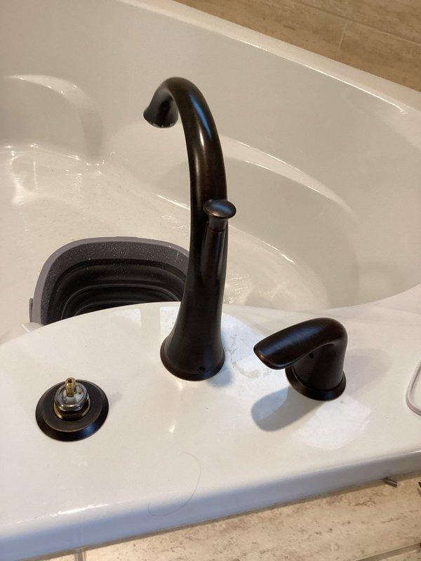 Responded to service call for a slow drip leak in a Roman tub faucet. Diagnosed issue with deteriorated cartridges. Successfully replaced both hot and cold cartridges in the matte black fixture, eliminating the leak and restoring proper function.