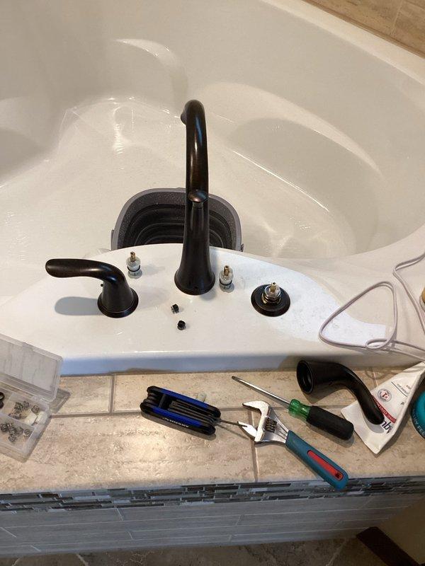 Responded to service call for a slow drip leak in a Roman tub faucet. Diagnosed issue with deteriorated cartridges. Successfully replaced both hot and cold cartridges in the matte black fixture, eliminating the leak and restoring proper function.