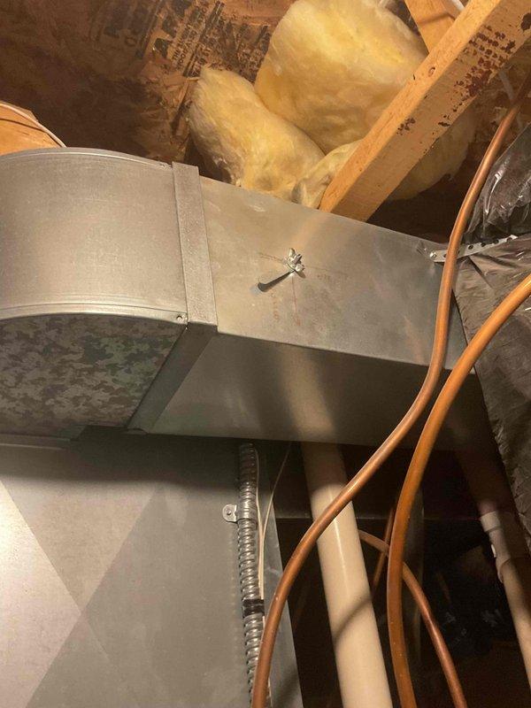 Responded to follow-up service call for recently installed furnace with uneven heating issues. Accessed attic to inspect ductwork and adjusted dampers on the trunk line serving the main level to redirect airflow to the second floor bedroom above garage. Modified thermostat settings from staged to variable capacity mode to improve temperature control throughout the home.