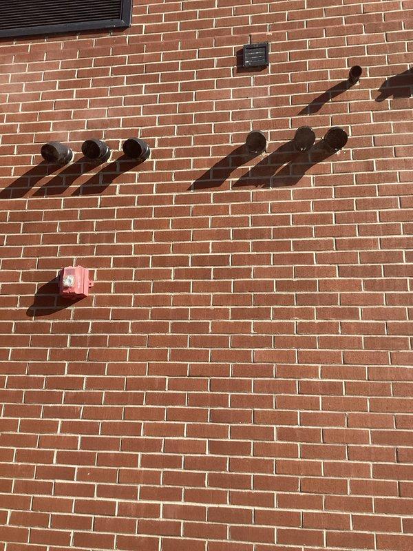 Diagnosed and resolved issues with multiple A.O. Smith water heaters. Reset control board on left unit by cycling power to clear BD code. Middle water heater displayed exhaust code; removed and cleaned exhaust trap which was heavily clogged with rusted material. Both units operational after service.