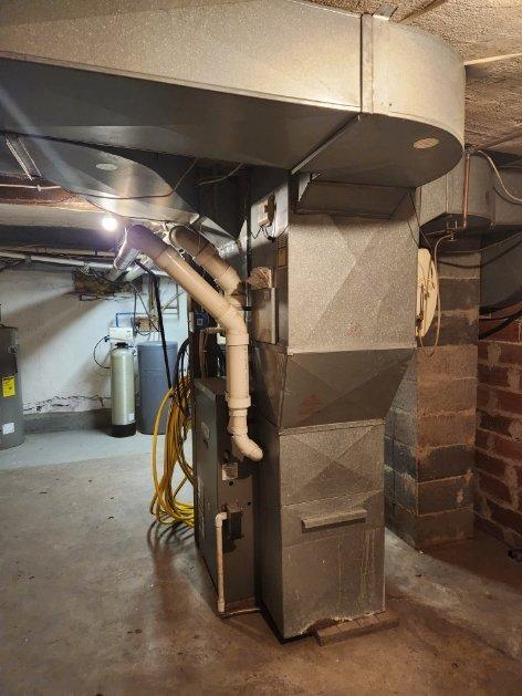Performed routine maintenance on 20-year-old furnace. Identified inducer motor with failing bearings causing loud vibration, corroded burners, debris in blower motor fins, and dirty filter. Heat exchanger was intact and furnace operation tested normal despite issues. Recommended estimates for inducer and burner replacement due to equipment age.