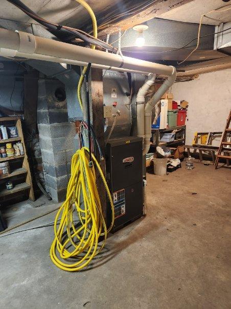 Performed routine maintenance on 20-year-old furnace. Identified inducer motor with failing bearings causing loud vibration, corroded burners, debris in blower motor fins, and dirty filter. Heat exchanger was intact and furnace operation tested normal despite issues. Recommended estimates for inducer and burner replacement due to equipment age.