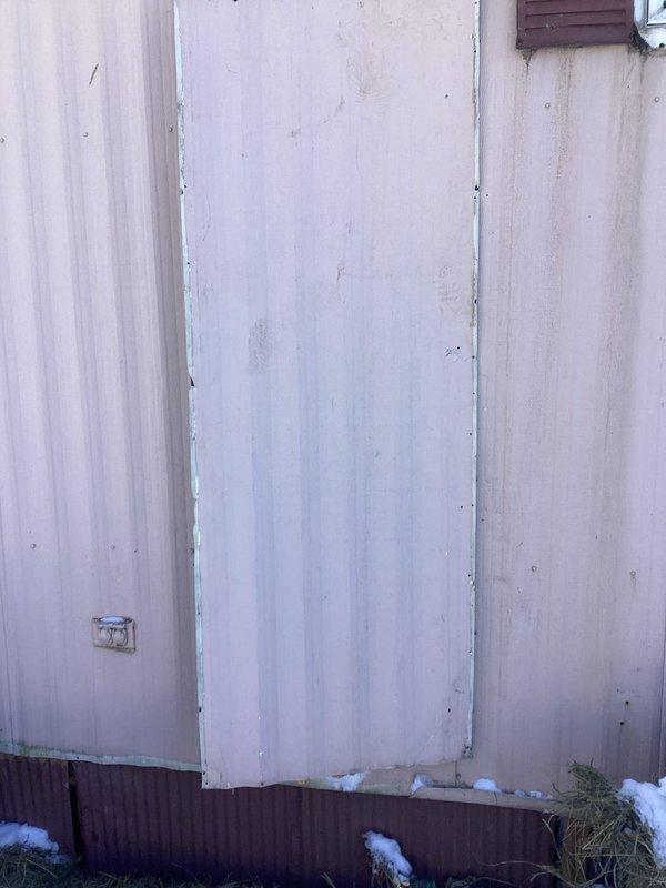 Installed customer-supplied water heater in mobile home, converting from electric to gas system. Observed significant mineral/sediment buildup around kitchen faucet and provided estimate for replacement, which customer declined.