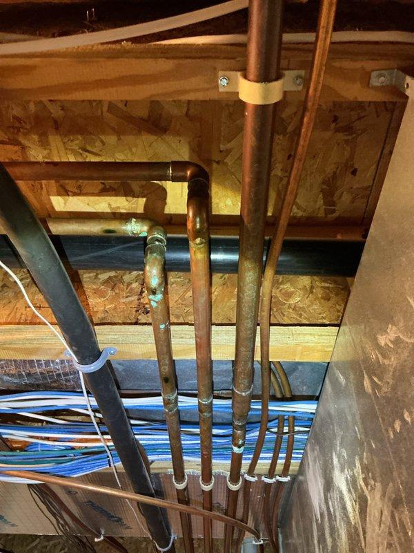 Responded to water leak in basement mechanical room where 3/4" copper pipe was leaking at two 90-degree fittings. Replaced damaged sections of copper piping and installed new angle stop valve for humidifier to completely resolve the leak issue.