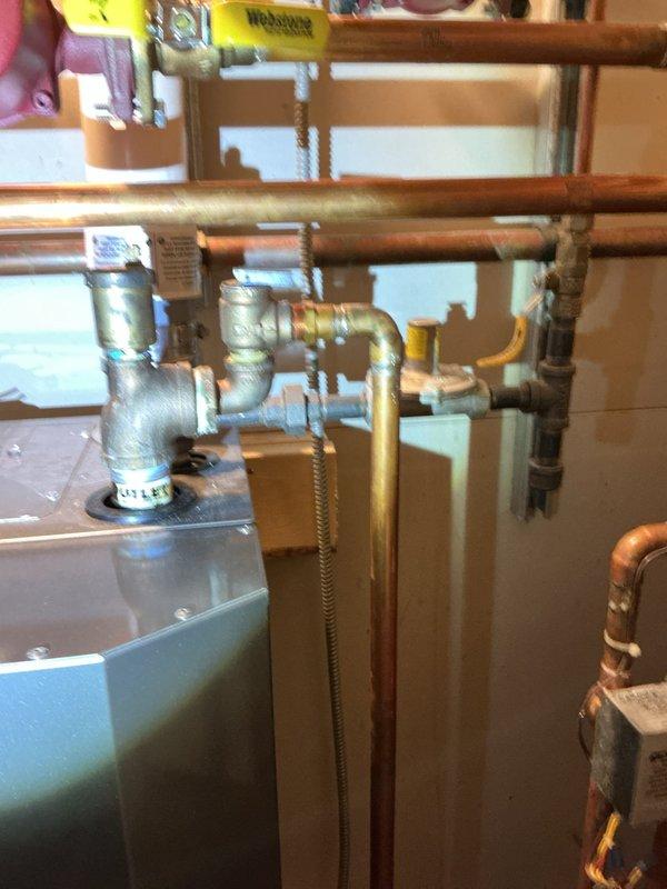 Responded to water leak in basement mechanical room where 3/4" copper pipe was leaking at two 90-degree fittings. Replaced damaged sections of copper piping and installed new angle stop valve for humidifier to completely resolve the leak issue.