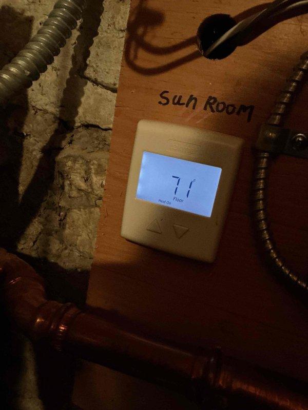 Responded to service call for one-month-old boiler system where in-floor heating had stopped functioning in sunroom and master bathroom. Diagnosed failed zone valve for the sunroom and determined that high demand from air handlers was causing supply temperature drops across all zones. Replaced defective Powerhead, which restored proper operation, with sunroom floor temperature increasing from 60°F to 71°F by completion of service.