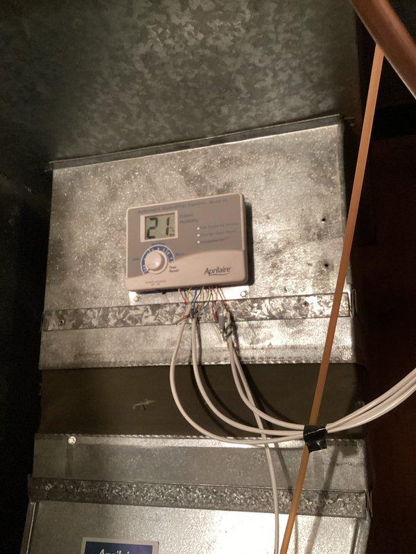Responded to service call for non-functional humidifier. Discovered front cover was not properly secured, preventing electrical connection. Reattached cover completely, restoring normal operation of the humidifier. Verified Aprilaire humidity control system was functioning correctly after repair. Addressed additional homeowner questions regarding HVAC system operation.