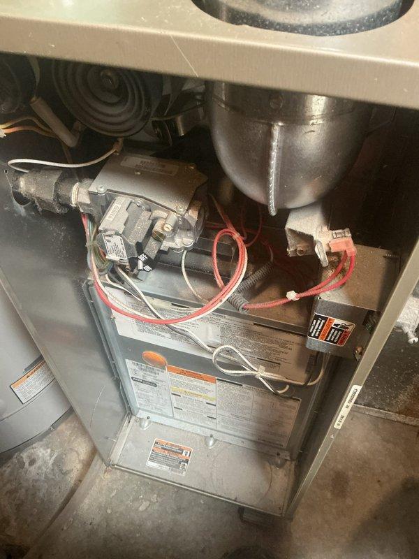 Performed comprehensive furnace tune-up on 15-year-old standard efficiency unit. Identified multiple critical issues including high-amp inducer draft motor, oil-leaking blower motor, control board with burn marks, and heat exchanger with temperature stress points. Adjusted excessive gas pressure from 3.7" WC down to 3.47" WC. Recommended replacement of inducer, blower, and control board to prevent imminent system failure.