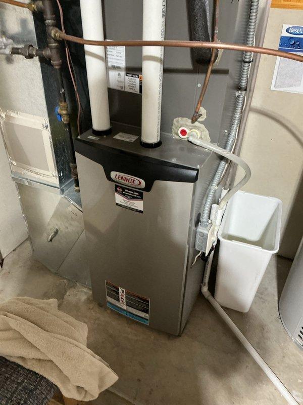 Performed routine tune-up on a 2-year-old Lennox furnace including inspection and filter check. Identified and corrected water line issue with humidifier that was causing leakage - the water line into pad was not properly inserted. Provided customer education on proper rack operation for humidifier pad placement to prevent future problems.
