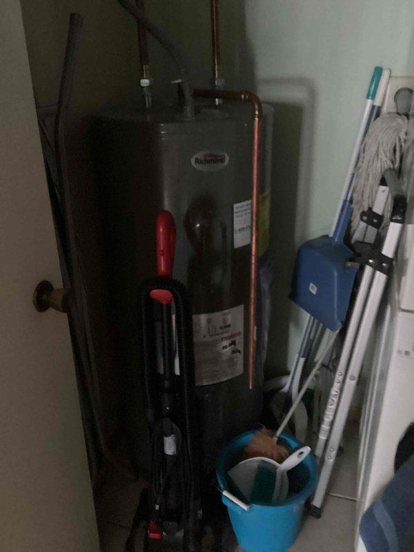 Diagnosed bathtub leak originating from faulty shower cartridge causing continuous dripping. Inspected water heater system in utility area to verify proper function. Provided client with options for complete fixture replacement to resolve the ongoing issue.