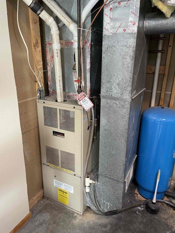 Responded to service call for 30-year-old AMANA furnace not maintaining adequate heating. Diagnostic inspection revealed severely plugged air filter due to ultrasonic humidifier operation and significant damage to the burner faceplate, including multiple cracks and blow-out conditions. Demonstrated these critical safety issues to resident. Given the age of the unit and extent of heat exchanger damage, replacement was recommended rather than repair. Scheduled follow-up appointment with advisor to discuss replacement options.