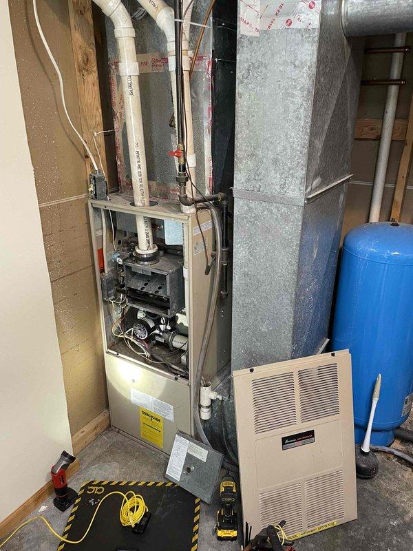 Responded to service call for 30-year-old AMANA furnace not maintaining adequate heating. Diagnostic inspection revealed severely plugged air filter due to ultrasonic humidifier operation and significant damage to the burner faceplate, including multiple cracks and blow-out conditions. Demonstrated these critical safety issues to resident. Given the age of the unit and extent of heat exchanger damage, replacement was recommended rather than repair. Scheduled follow-up appointment with advisor to discuss replacement options.